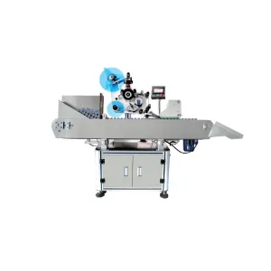 Vorderansicht einer automatischen Etikettiermaschine für kleine Flaschen und Tuben