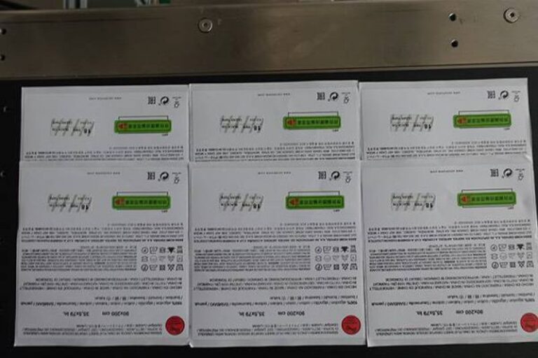Labeled box with automatic labeling machine for packaging, logistics, and industrial applications