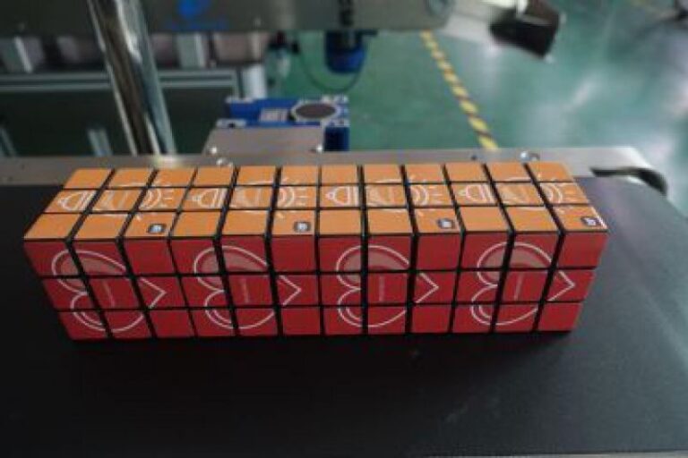 Labeled Rubik’s cube with automatic labeling machine applied for promotional and creative packaging applications