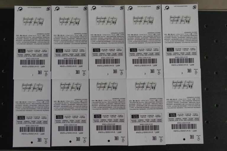 Labeled hanging clothing tags with automatic labeling machine for apparel and garment tagging applications